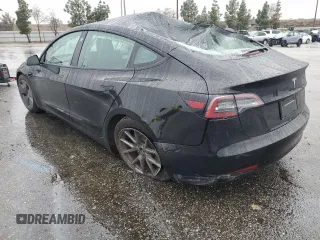 2023 Tesla Model 3 with VIN 5YJ3E1EA2PF671865, listed as a Copart auction lot 45220285 with 29,614 mi miles and Salvage title. Bid and sale history available at DreamBid. Image 2.