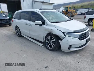 2021 Honda Odyssey Touring with VIN 5FNRL6H80MB010952, listed as a IAAI auction lot 42080412 with 90,594 mi miles and . Bid and sale history available at DreamBid. Image 1.