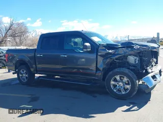 2015 Ford F-150 XLT with VIN 1FTEW1EG4FFC84691, listed as a IAAI auction lot 41651229 with 144,784 mi miles. Bid and sale history available at carsss.com. Image 14.