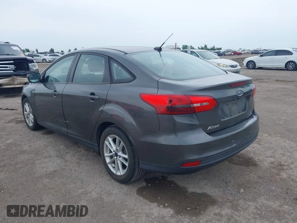 2017 Ford Focus SE z VIN 1FADP3F21HL205009, wystawiony jako IAAI lot #42305641 z przebiegiem 75 160 mil mil oraz . Historia ofert i sprzedaży dostępna na DreamBid. Obrazek 3.