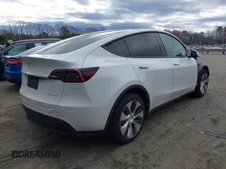 2023 Tesla Model Y Long Range z VIN 7SAYGDEE4PF621640, wystawiony jako IAAI lot #41796502 z przebiegiem 68 484 mil mil oraz . Historia ofert i sprzedaży dostępna na DreamBid. Obrazek 4.