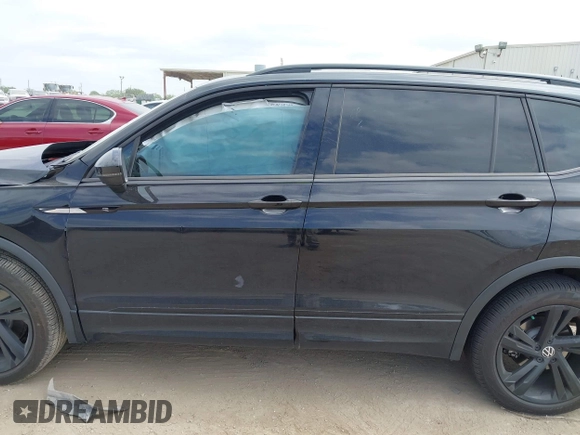 2023 Volkswagen Tiguan SE R-Line Black with VIN 3VVCB7AX0PM122636, listed as a IAAI auction lot 42040494 with 8,589 mi miles and . Bid and sale history available at DreamBid. Image 14.