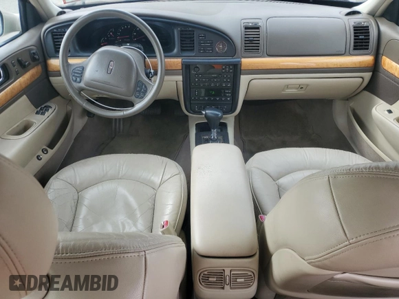 2001 Lincoln Continental z VIN 1LNHM97V71Y711352, wystawiony jako Copart lot #46235305 z przebiegiem 122 786 mil mil oraz Szkoda całkowita • Salvage title. Historia ofert i sprzedaży dostępna na DreamBid. Obrazek 8.