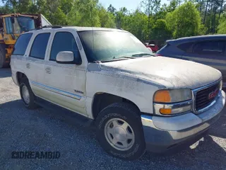 2005 GMC Yukon SLT with VIN 1GKEC13T15J147023, listed as a IAAI auction lot 41993666 with 250,216 mi miles. Bid and sale history available at carsss.com. Image 1.