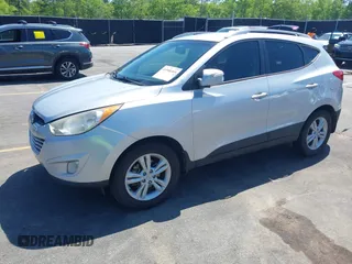 2013 Hyundai Tucson GLS with VIN KM8JU3AC3DU551018, listed as a IAAI auction lot 41988305 with 214,728 mi miles. Bid and sale history available at carsss.com. Image 17.