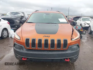 2016 Jeep Cherokee Trailhawk z VIN 1C4PJMBS0GW155379, wystawiony jako IAAI lot #41472352 z przebiegiem 116 036 mil mil oraz . Historia ofert i sprzedaży dostępna na DreamBid. Obrazek 12.