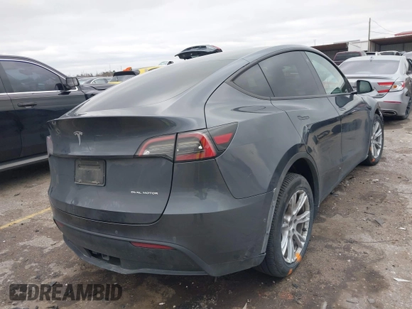 2023 Tesla Model Y Long Range with VIN 7SAYGAEE8PF587202, listed as a IAAI auction lot 41306811 with 1 mi miles. Bid and sale history available at carsss.com. Image 4.