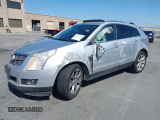 2011 Cadillac SRX Premium Collection z VIN 3GYFNFEYXBS599279, wystawiony jako IAAI lot #42372367 z przebiegiem 97 888 mil mil oraz . Historia ofert i sprzedaży dostępna na DreamBid. Obrazek 2.