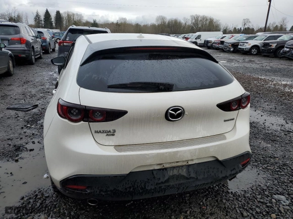 2021 Mazda Mazda3 Hatchback Premium with VIN JM1BPBML8M1302348, listed as a Copart auction lot 86628754 with 70,331 mi miles and Salvage Title. Bid and sale history available at carsss.com. Image 6.