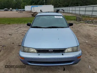 1995 Toyota Corolla DX with VIN 2T1AE09B5SC127586, listed as a Copart auction lot 57075045 with 244,969 mi miles and Salvage title. Bid and sale history available at DreamBid. Image 5.