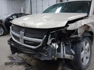 2010 Dodge Journey SXT with VIN 3D4PH5FVXAT180831, listed as a IAAI auction lot 41506328 with 155,482 mi miles. Bid and sale history available at carsss.com. Image 6.