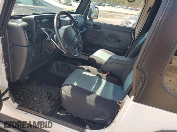 2003 Jeep Wrangler Rubicon z VIN 1J4FA69S73P333199, wystawiony jako Copart lot #50602615 z przebiegiem 133 254 mil mil oraz Szkoda całkowita • Salvage title. Historia ofert i sprzedaży dostępna na DreamBid. Obrazek 7.