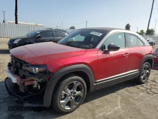 2022 Mazda MX-30 Premium Plus Package with VIN JM1DRADB7N0100256, listed as a Copart auction lot 69304084 with 11,057 mi miles and Salvage Title. Bid and sale history available at carsss.com. Image 1.