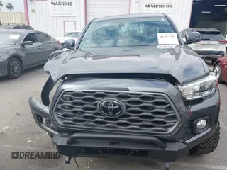 2021 Toyota Tacoma SR z VIN 3TMCZ5AN9MM397611, wystawiony jako IAAI lot #41467705 z przebiegiem 65 191 mil mil oraz . Historia ofert i sprzedaży dostępna na DreamBid. Obrazek 12.