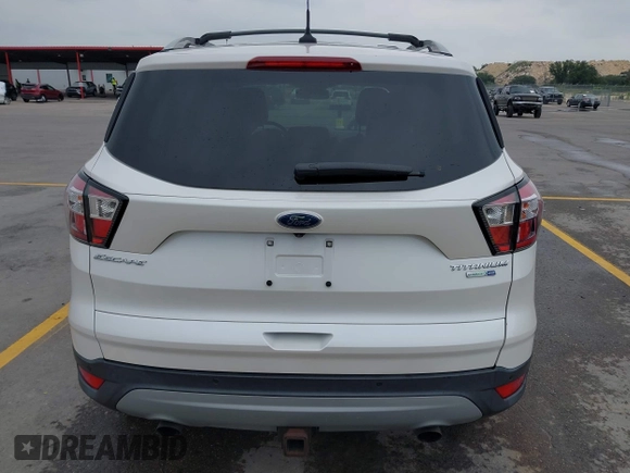 2018 Ford Escape Titanium with VIN 1FMCU9J98JUB87867, listed as a IAAI auction lot 42300123 with 48,357 mi miles and . Bid and sale history available at DreamBid. Image 16.