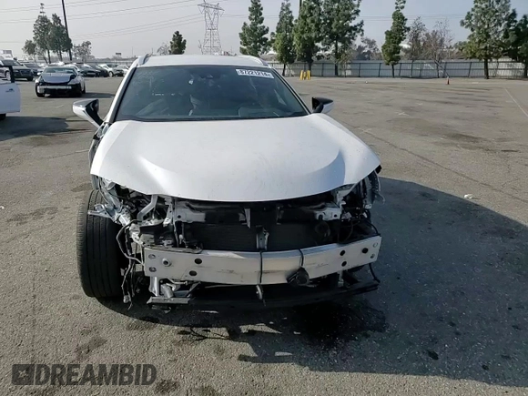 2022 Lexus UX 250h with VIN JTHX9JBH2N2056285, listed as a Copart auction lot 87221214 with 33,377 mi miles and Salvage title. Bid and sale history available at DreamBid. Image 11.