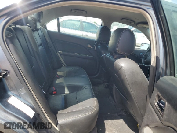 2012 Ford Fusion SEL z VIN 3FAHP0JG7CR297174, wystawiony jako Copart lot #55469005 z przebiegiem 129 434 mil mil oraz Szkoda całkowita • Salvage title. Historia ofert i sprzedaży dostępna na DreamBid. Obrazek 10.