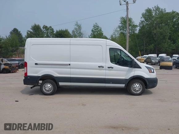 2024 Ford Transit Cargo with VIN 1FTBR2C82RKA72122, listed as a IAAI auction lot 42432209 with 26,806 mi miles and . Bid and sale history available at DreamBid. Image 13.
