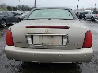2004 Cadillac DeVille DTS z VIN 1G6KF57944U117834, wystawiony jako Copart lot #89320975 z przebiegiem 149 820 mil mil oraz Szkody całkowita. Historia ofert i sprzedaży dostępna na DreamBid. Obrazek 6.