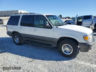 2000 Mercury Mountaineer with VIN 4M2ZU66P7YUJ00713, listed as a Copart auction lot 87246864 with 240,733 mi miles and Clean Title. Bid and sale history available at carsss.com. Image 4.