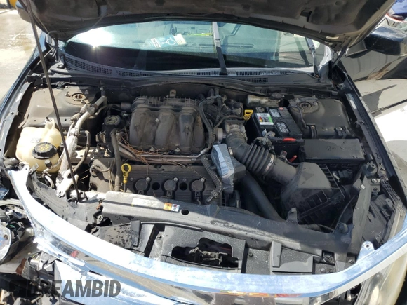 2012 Ford Fusion SE z VIN 3FAHP0HGXCR117692, wystawiony jako Copart lot #56026555 z przebiegiem 236 669 mil mil oraz Szkoda całkowita • Salvage title. Historia ofert i sprzedaży dostępna na DreamBid. Obrazek 11.