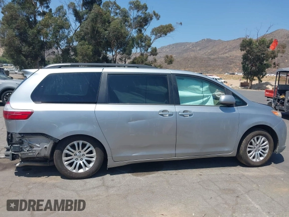2015 Toyota Sienna XLE with VIN 5TDYK3DC0FS589947, listed as a IAAI auction lot 36567379 with 130,969 mi miles and . Bid and sale history available at DreamBid. Image 14.