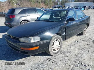 1994 Toyota Camry XLE with VIN JT2GK13E9R0025099, listed as a IAAI auction lot 41735273 with 281,833 mi miles. Bid and sale history available at carsss.com. Image 2.