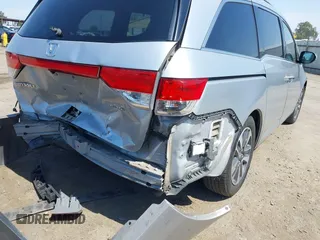 2014 Honda Odyssey Touring with VIN 5FNRL5H91EB068427, listed as a IAAI auction lot 42163315 with 184,134 mi miles and . Bid and sale history available at DreamBid. Image 6.