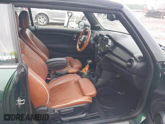 2016 MINI Convertible with VIN WMWWG5C51G3C19231, listed as a IAAI auction lot 42246342 with 93,576 mi miles and . Bid and sale history available at DreamBid. Image 5.