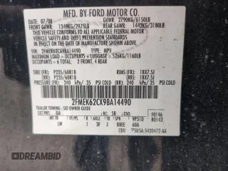 2009 Ford Flex SEL z VIN 2FMEK62CX9BA14490, wystawiony jako Copart lot #58776655 z przebiegiem 214 426 mil mil oraz Szkoda całkowita • Salvage title. Historia ofert i sprzedaży dostępna na DreamBid. Obrazek 13.