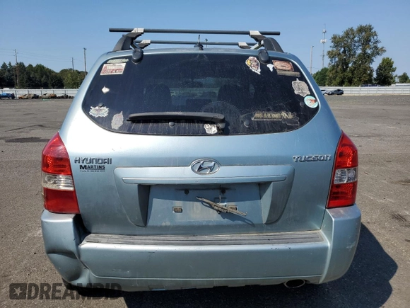 2009 Hyundai Tucson GLS with VIN KM8JM12B29U953176, listed as a Copart auction lot 70141174 with 77,132 mi miles and Salvage Title. Bid and sale history available at carsss.com. Image 6.