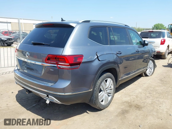 2019 Volkswagen Atlas SEL z VIN 1V2ER2CA5KC555568, wystawiony jako IAAI lot #42050516 z przebiegiem 71 599 mil mil oraz . Historia ofert i sprzedaży dostępna na DreamBid. Obrazek 4.