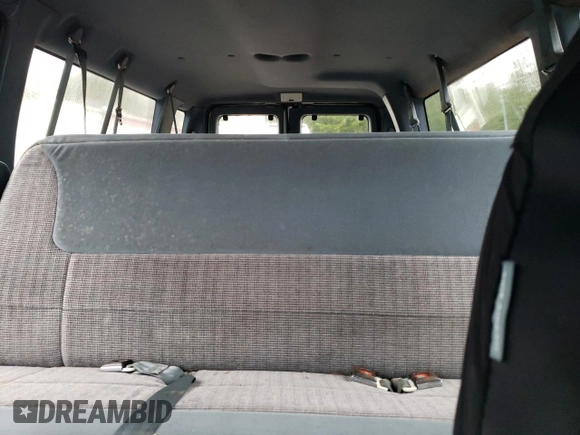 1994 Ford Econoline Wagon XL z VIN 1FBJS31H1RHB32773, wystawiony jako Copart lot #82008864 z przebiegiem Nie podano mil oraz Tytuł czysty. Historia ofert i sprzedaży dostępna na DreamBid. Obrazek 10.