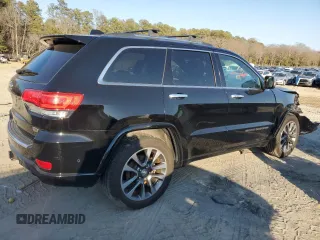 2017 Jeep Grand Cherokee Overland with VIN 1C4RJFCT5HC828780, listed as a Copart auction lot 46874965 with 90,269 mi miles and Salvage Title. Bid and sale history available at carsss.com. Image 3.