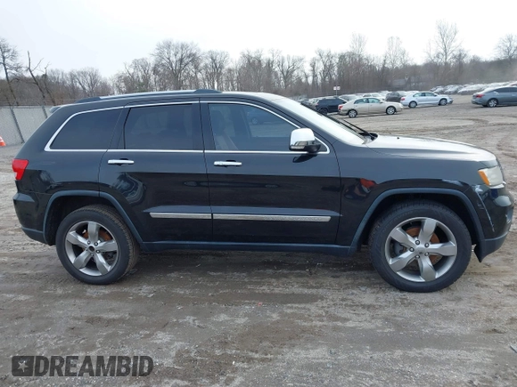 2013 Jeep Grand Cherokee Overland with VIN 1C4RJECG5DC621149, listed as a IAAI auction lot 41255140 with 157,355 mi miles. Bid and sale history available at carsss.com. Image 13.