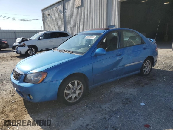 2005 Kia Spectra LX z VIN KNAFE121655113045, wystawiony jako Copart lot #61199595 z przebiegiem 156 310 mil mil oraz Szkoda całkowita • Salvage title. Historia ofert i sprzedaży dostępna na DreamBid. Obrazek 1.