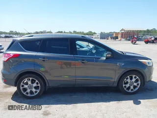 2016 Ford Escape Titanium with VIN 1FMCU0J95GUB11995, listed as a IAAI auction lot 42065255 with 142,390 mi miles. Bid and sale history available at carsss.com. Image 13.