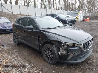 2018 Mazda CX-3 Touring z VIN JM1DKFC78J0314830, wystawiony jako IAAI lot #42012742 z przebiegiem 46 976 mil mil oraz . Historia ofert i sprzedaży dostępna na DreamBid. Obrazek 1.