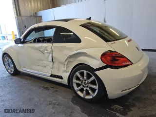 2012 Volkswagen Beetle 2.5L w/Sun/Sound/Nav PZEV with VIN 3VWHP7AT5CM638470, listed as a Copart auction lot 83471284 with 87,912 mi miles and Clean Title. Bid and sale history available at carsss.com. Image 2.