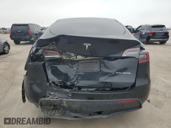 2022 Tesla Model Y Long Range with VIN 7SAYGAEE1NF381491, listed as a Copart auction lot 52694185 with 33,412 mi miles and Salvage Title. Bid and sale history available at DreamBid. Image 6.