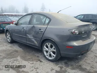 2009 Mazda Mazda3 i Touring Value with VIN JM1BK32G291214834, listed as a IAAI auction lot 40894075 with 128,040 mi miles. Bid and sale history available at carsss.com. Image 3.