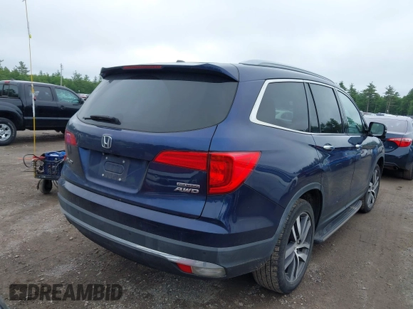 2017 Honda Pilot Touring with VIN 5FNYF6H99HB093136, listed as a IAAI auction lot 42507326 with 125,579 mi miles and . Bid and sale history available at DreamBid. Image 4.