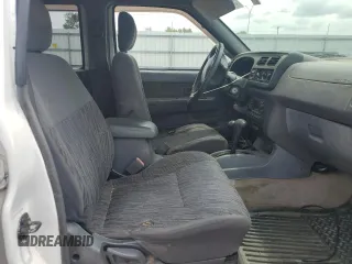 2000 Nissan Frontier XE with VIN 1N6ED27Y6YC334154, listed as a Copart auction lot 54140454 with 330,552 mi miles and Salvage title. Bid and sale history available at DreamBid. Image 7.
