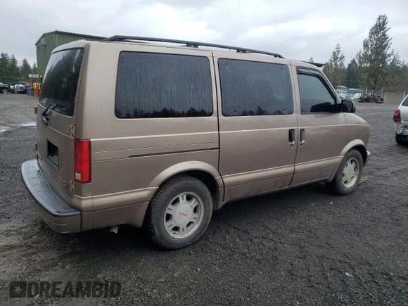 2003 GMC Safari z VIN 1GKEL19X43B503725, wystawiony jako Copart lot #47262655 z przebiegiem 208 200 mil mil oraz Szkody całkowita. Historia ofert i sprzedaży dostępna na DreamBid. Obrazek 3.