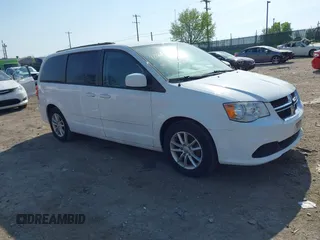 2016 Dodge Grand Caravan SXT with VIN 2C4RDGCG5GR275876, listed as a IAAI auction lot 42121344 with 140,652 mi miles. Bid and sale history available at carsss.com. Image 1.