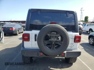 2019 Jeep Wrangler Unlimited Sport Altitude with VIN 1C4HJXDG2KW675235, listed as a Copart auction lot 54389785 with 88,825 mi miles and Salvage title. Bid and sale history available at DreamBid. Image 6.