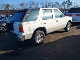 1994 Isuzu Rodeo LS z VIN 4S2CG58V5R4332970, wystawiony jako IAAI lot #41680075 z przebiegiem 182 330 mil mil oraz . Historia ofert i sprzedaży dostępna na DreamBid. Obrazek 4.