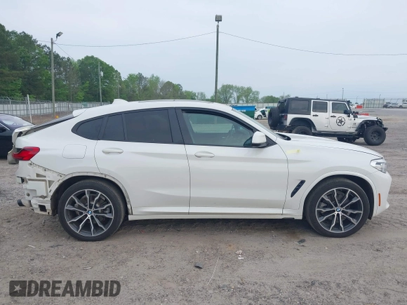2019 BMW X4 xDrive30i with VIN 5UXUJ3C52KLG54945, listed as a IAAI auction lot 42083434 with 153,956 mi miles and . Bid and sale history available at DreamBid. Image 14.