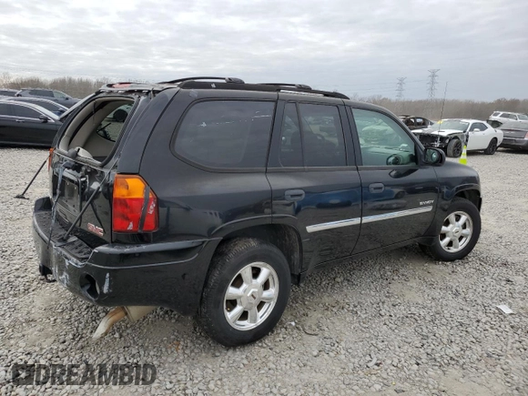 2006 GMC Envoy SLT with VIN 1GKDS13SX62354690, listed as a Copart auction lot 84138814 with 194,669 mi miles and Salvage Title. Bid and sale history available at carsss.com. Image 3.