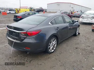 2016 Mazda Mazda6 i Touring with VIN JM1GJ1V56G1462637, listed as a IAAI auction lot 41603296 with 143,931 mi miles. Bid and sale history available at carsss.com. Image 4.